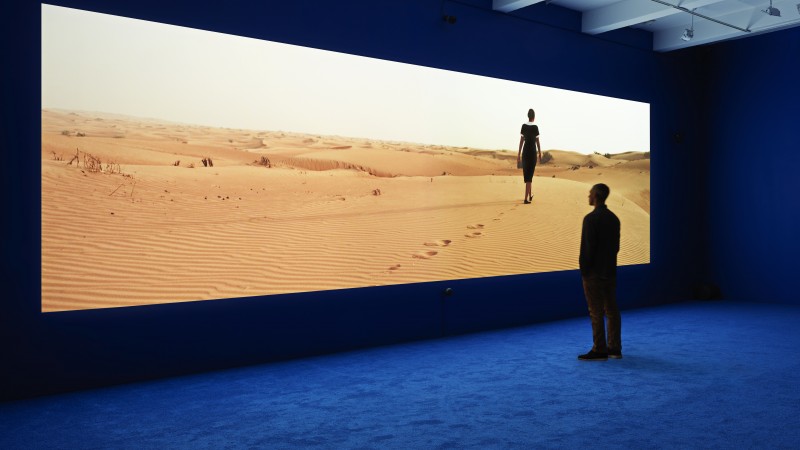 Isaac Julien, Playtime, 2013, installation view, Metro Pictures, New York, 2013, double projection on single screen high definition video installation with 7.1 surround sound, 38’16’’, gift of Sheridan Brown, © Isaac Julien, photo courtesy the artist and Metro Pictures, New York, photograph: Genevieve Hanson 