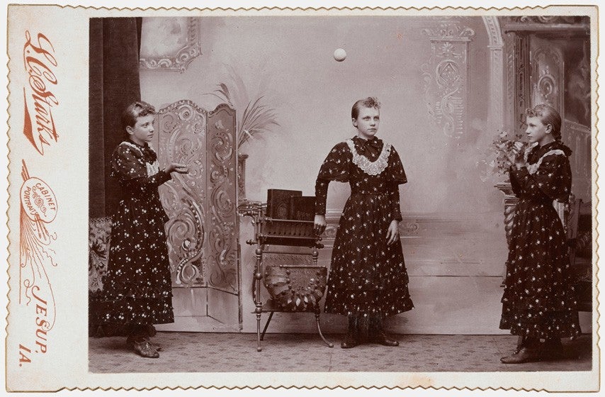 Tossing a ball, 1890s